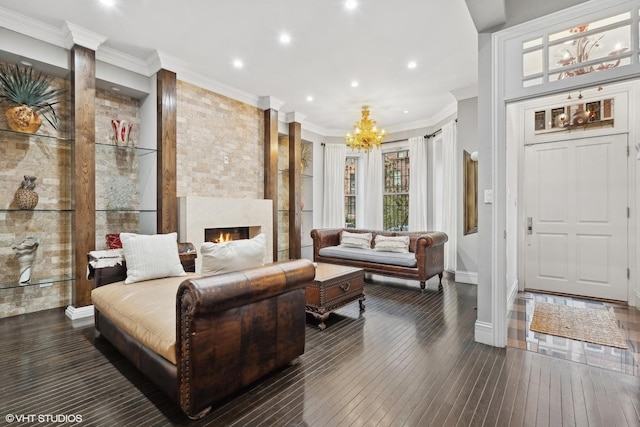 69 E Cedar St, Chicago, IL 60611 - living area featuring a chandelier, recessed lighting, hardwood / wood-style flooring, crown molding, and a fireplace