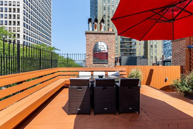 69 E Cedar St, Chicago, IL 60611 - wooden terrace with outdoor dining space