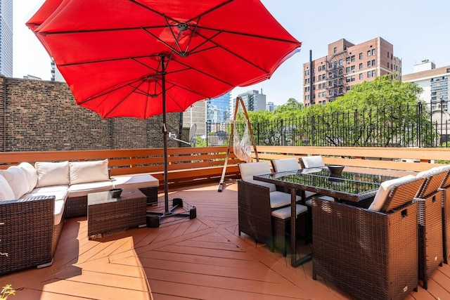 69 E Cedar St, Chicago, IL 60611 - wooden deck featuring outdoor lounge area and outdoor dining area