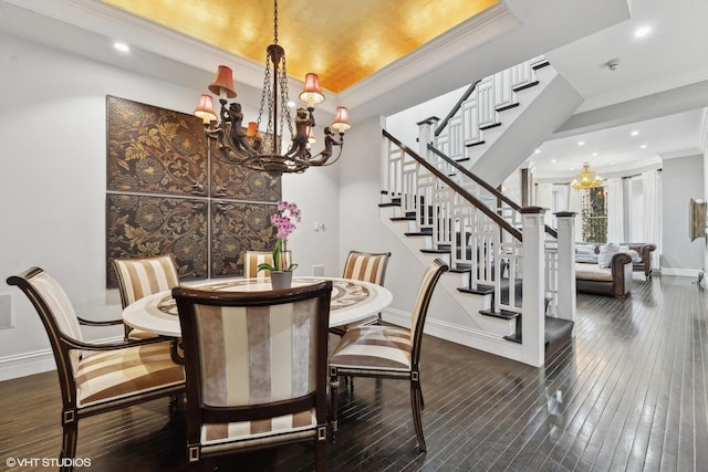 69 E Cedar St, Chicago, IL 60611 - dining space featuring a chandelier, crown molding, baseboards, stairs, and wood-type flooring
