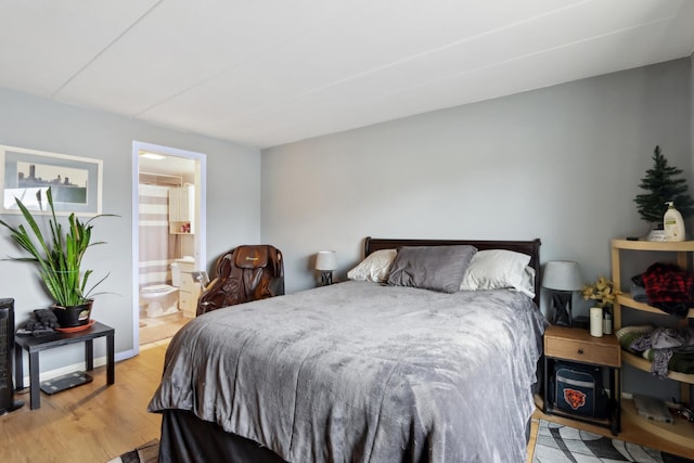 915 Graceland Ave Unit 1E, Des Plaines, IL 60016 - bedroom with light wood-type flooring and connected bathroom