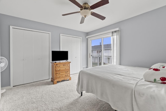 410 Meadow Green Ln, Round Lake, IL 60073 - bedroom featuring multiple closets, carpet flooring, and a ceiling fan