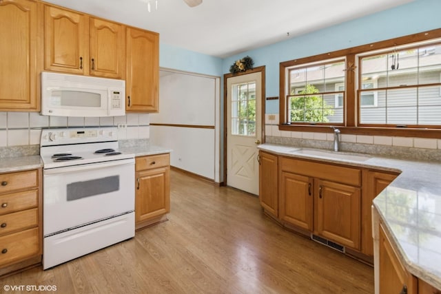 236 S Edgewood Ave, Lombard, IL 60148 - kitchen featuring white appliances, backsplash, light wood-style floors, light countertops, and a ceiling fan