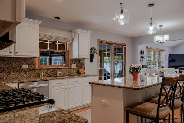 18132 Crystal Ln, Lansing, IL 60438 - kitchen with a sink, a breakfast bar area, tasteful backsplash, and stone countertops