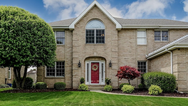 18132 Crystal Ln, Lansing, IL 60438 - view of front of house with brick siding, a front yard, and roof with shingles