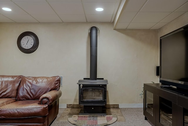 18132 Crystal Ln, Lansing, IL 60438 - living room with baseboards, a wood stove, a paneled ceiling, and recessed lighting