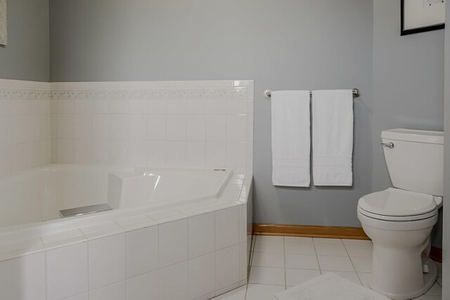 18132 Crystal Ln, Lansing, IL 60438 - full bathroom with a bath, baseboards, toilet, and tile patterned flooring