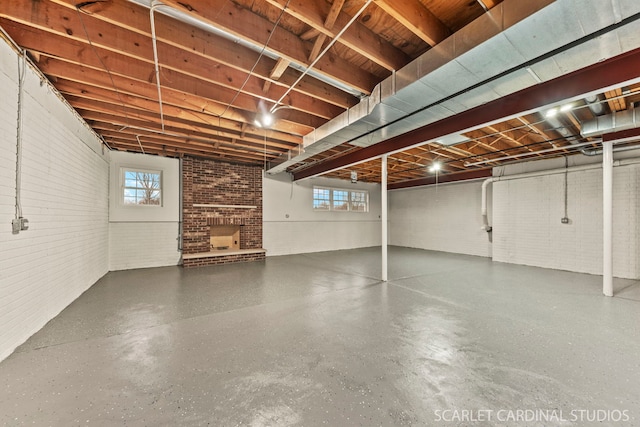 1502 Cherry Rd, Oswego, IL 60543 - below grade area featuring brick wall and a fireplace