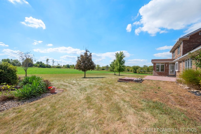 1502 Cherry Rd, Oswego, IL 60543 - view of grassy yard featuring a patio