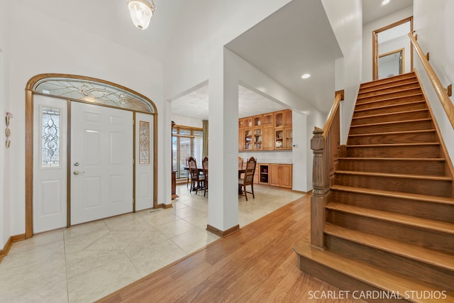 1502 Cherry Rd, Oswego, IL 60543 - foyer entrance featuring stairs, baseboards, light tile patterned floors, and recessed lighting