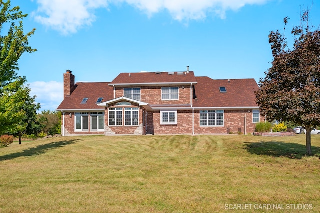 1502 Cherry Rd, Oswego, IL 60543 - back of property with brick siding, a chimney, and a yard