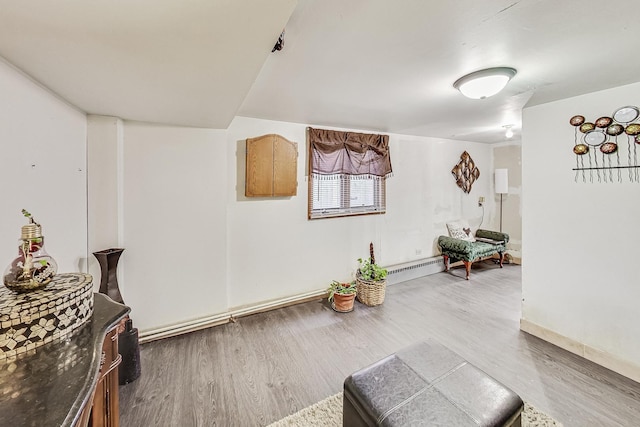 8404 N Greenwood Ave, Niles, IL 60714 - sitting room featuring wood finished floors, a baseboard heating unit, and baseboards