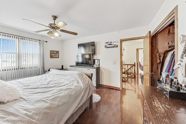 8404 N Greenwood Ave, Niles, IL 60714 - bedroom featuring dark wood-style flooring, baseboards, and a ceiling fan