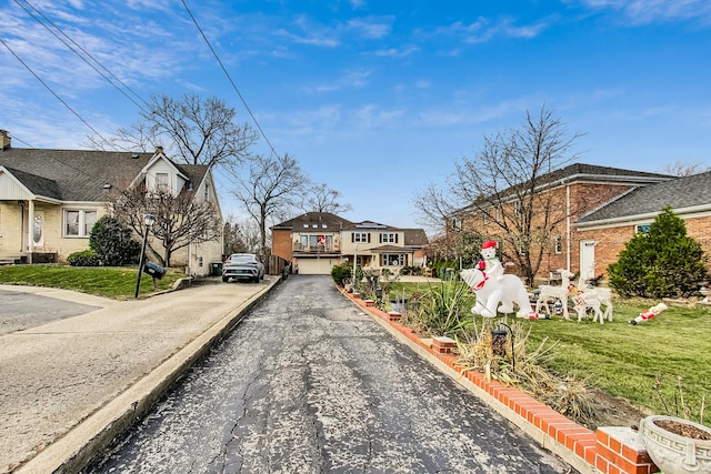 8404 N Greenwood Ave, Niles, IL 60714 - view of road with street lights and a residential view