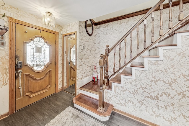 8404 N Greenwood Ave, Niles, IL 60714 - foyer with wallpapered walls, wood finished floors, stairway, a chandelier, and baseboards