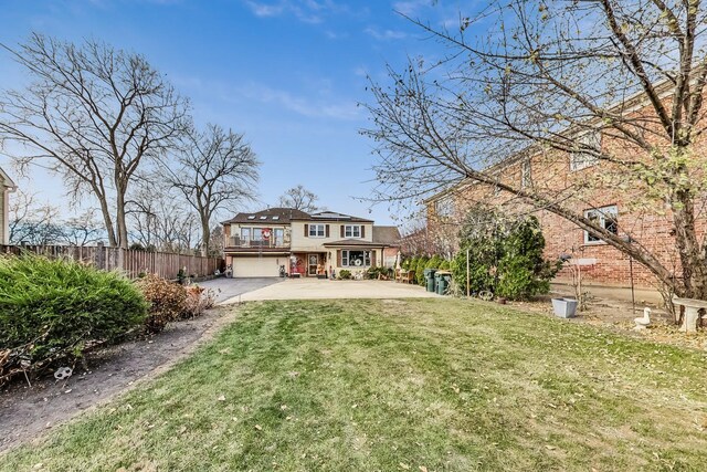 8404 N Greenwood Ave, Niles, IL 60714 - view of front of home featuring solar panels, asphalt driveway, and an attached garage