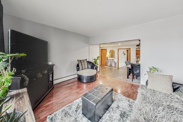 8404 N Greenwood Ave, Niles, IL 60714 - living room with baseboard heating and wood finished floors