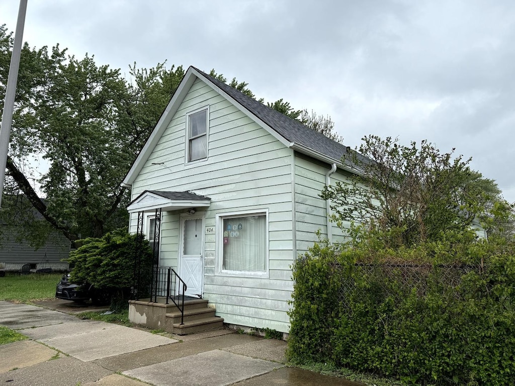 404 155th St, Calumet City, IL 60409 - view of front of house featuring a shingled roof