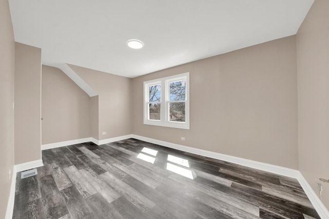 unfurnished room featuring wood finished floors and baseboards