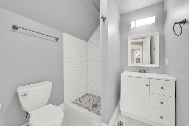 bathroom with toilet, a shower stall, baseboards, vanity, and plenty of natural light