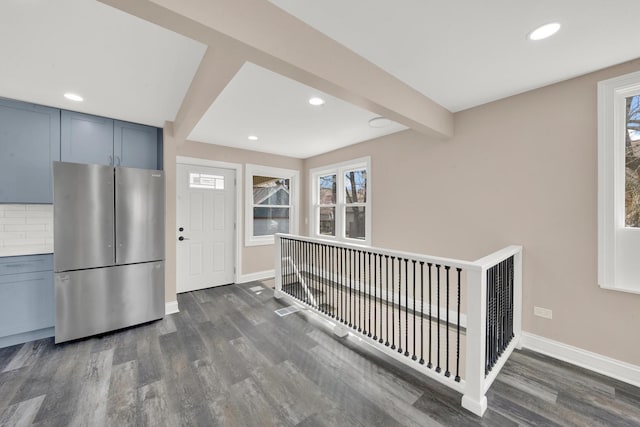 kitchen featuring freestanding refrigerator, dark wood-type flooring, baseboards, recessed lighting, and beamed ceiling