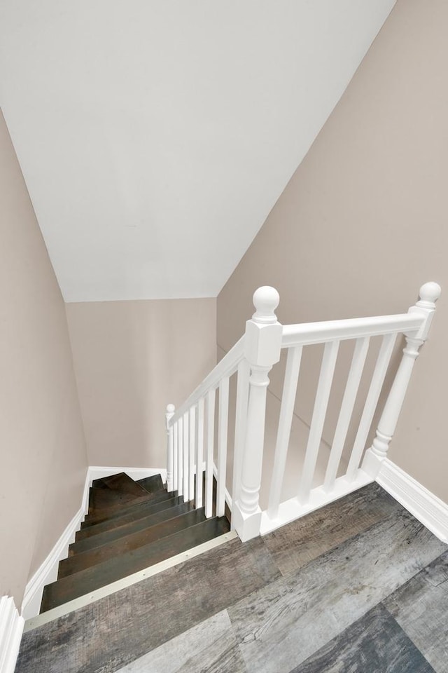 staircase with wood finished floors