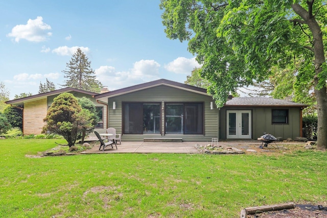 32225 N Pine Ave, Grayslake, IL 60030 - rear view of house featuring french doors, a patio area, a lawn, and board and batten siding