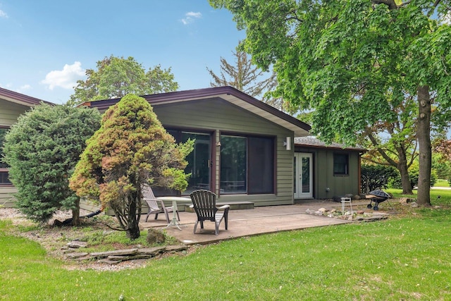 32225 N Pine Ave, Grayslake, IL 60030 - rear view of house featuring a patio, a yard, and board and batten siding