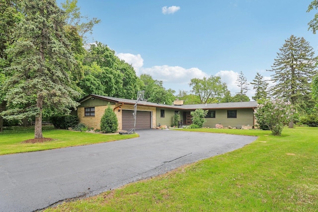 32225 N Pine Ave, Grayslake, IL 60030 - ranch-style home featuring an attached garage, a front lawn, asphalt driveway, and a chimney