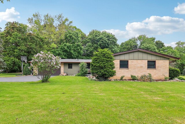 32225 N Pine Ave, Grayslake, IL 60030 - ranch-style house with a front lawn, driveway, brick siding, and board and batten siding