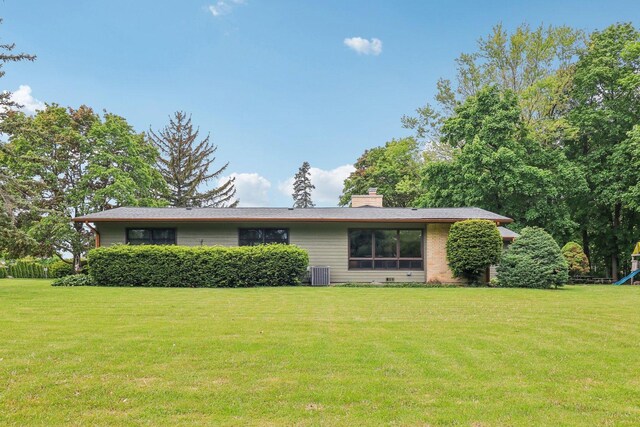 32225 N Pine Ave, Grayslake, IL 60030 - view of front of property with a front lawn, a chimney, and central AC unit