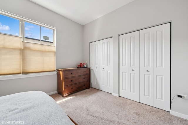 51 E 23rd St Unit 0, Chicago, IL 60616 - carpeted bedroom featuring multiple closets and baseboards