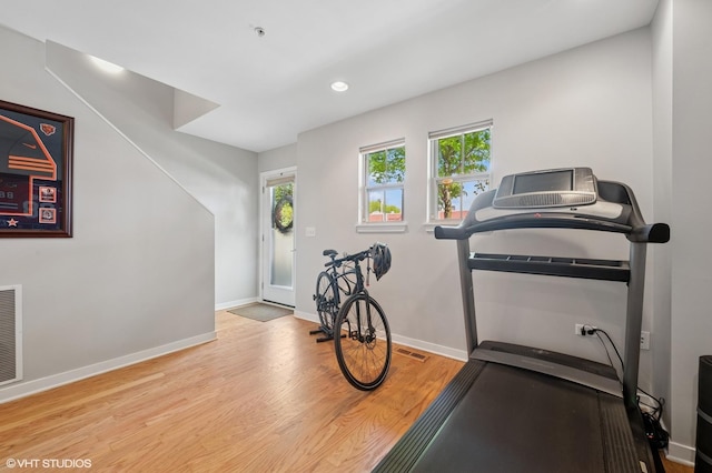 51 E 23rd St Unit 0, Chicago, IL 60616 - workout area with healthy amount of natural light, wood finished floors, baseboards, and recessed lighting