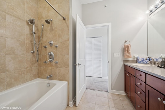 51 E 23rd St Unit 0, Chicago, IL 60616 - bathroom with vanity, tile patterned flooring, baseboards, and shower / tub combination
