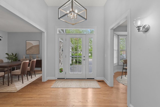 165 S Danbury Ct, Lake Forest, IL 60045 - entryway featuring a chandelier, light wood-type flooring, and baseboards