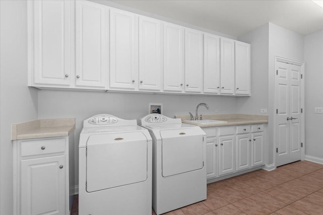 165 S Danbury Ct, Lake Forest, IL 60045 - laundry area with cabinet space, washing machine and dryer, light tile patterned floors, and baseboards
