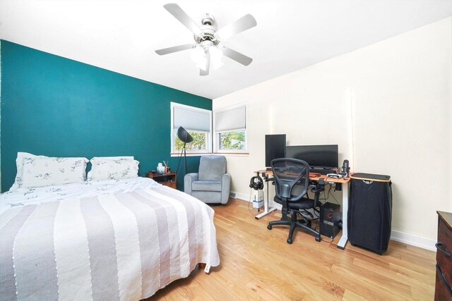 8619 Crawford Ave, Skokie, IL 60076 - bedroom featuring wood finished floors, baseboards, and a ceiling fan