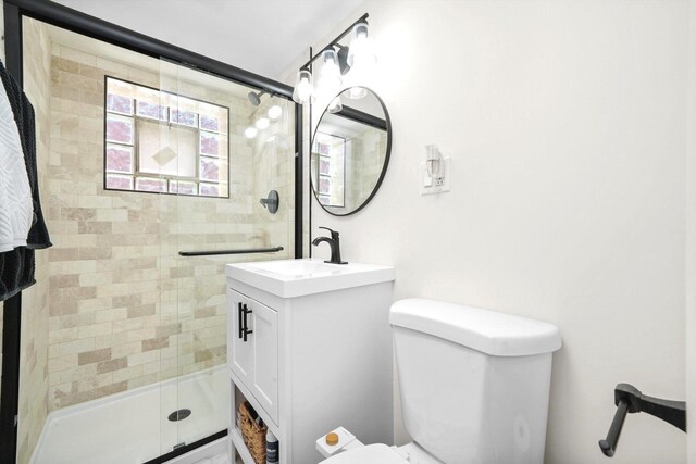 8619 Crawford Ave, Skokie, IL 60076 - bathroom featuring a shower stall, toilet, and vanity