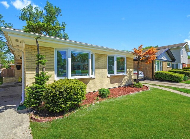 8619 Crawford Ave, Skokie, IL 60076 - ranch-style home featuring brick siding and a front lawn