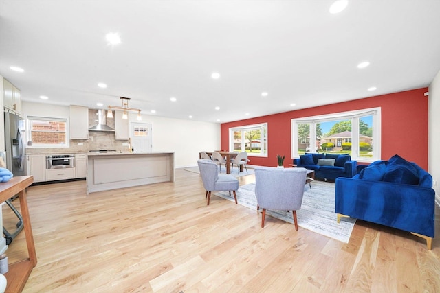 8619 Crawford Ave, Skokie, IL 60076 - living area featuring light wood-style floors and recessed lighting