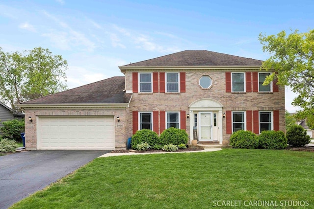 1903 Montclair Dr, Naperville, IL 60565 - view of front of property featuring asphalt driveway, brick siding, a garage, a front yard, and roof with shingles