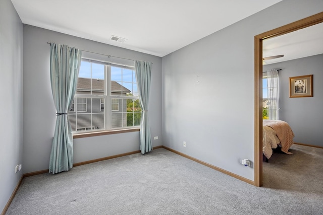 596 N Triumph Ct, Hainesville, IL 60073 - carpeted empty room featuring baseboards