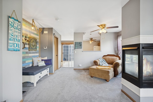 596 N Triumph Ct, Hainesville, IL 60073 - living area with ceiling fan, carpet flooring, and a multi sided fireplace
