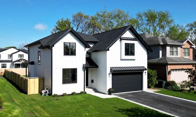 135 Lincoln St, Glenview, IL 60025 - modern inspired farmhouse with board and batten siding, an attached garage, driveway, and a standing seam roof