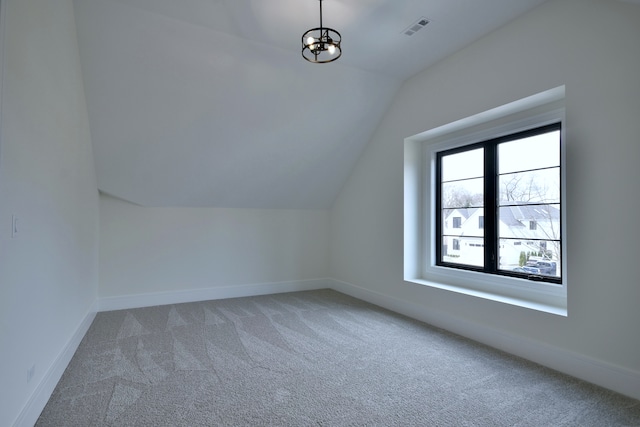 135 Lincoln St, Glenview, IL 60025 - bonus room featuring vaulted ceiling, carpet, baseboards, and a chandelier