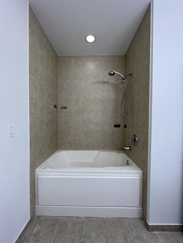 1150 W 15th St Unit 401, Chicago, IL 60608 - bathroom with tile patterned flooring, baseboards, and washtub / shower combination