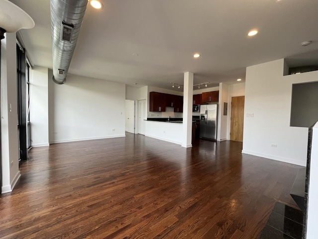 1150 W 15th St Unit 401, Chicago, IL 60608 - unfurnished living room featuring dark wood-type flooring, recessed lighting, and baseboards