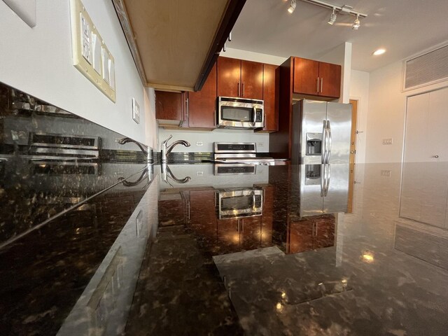 1150 W 15th St Unit 401, Chicago, IL 60608 - kitchen with stainless steel appliances, dark stone counters, and rail lighting