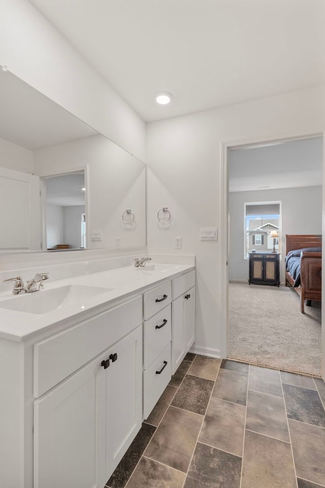 2461 Tahoe Ln, Pingree Grove, IL 60140 - bathroom with double vanity, connected bathroom, and baseboards