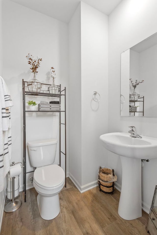 2461 Tahoe Ln, Pingree Grove, IL 60140 - bathroom with wood finished floors, toilet, and baseboards